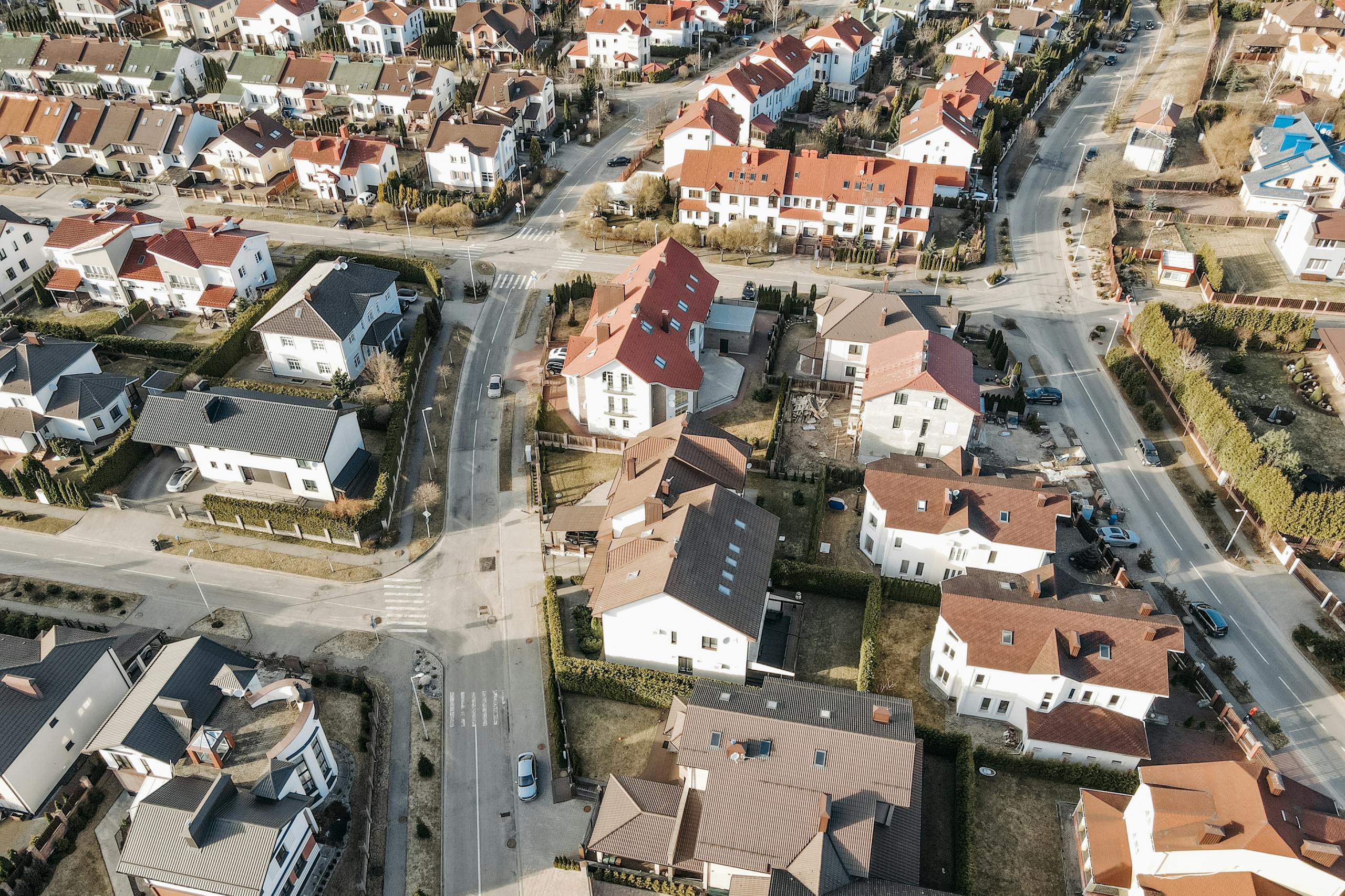 Aerial view of a suburban neighborhood with charming houses and clean streets.